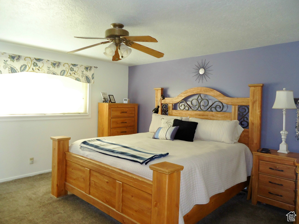 Bedroom with carpet flooring and a ceiling fan