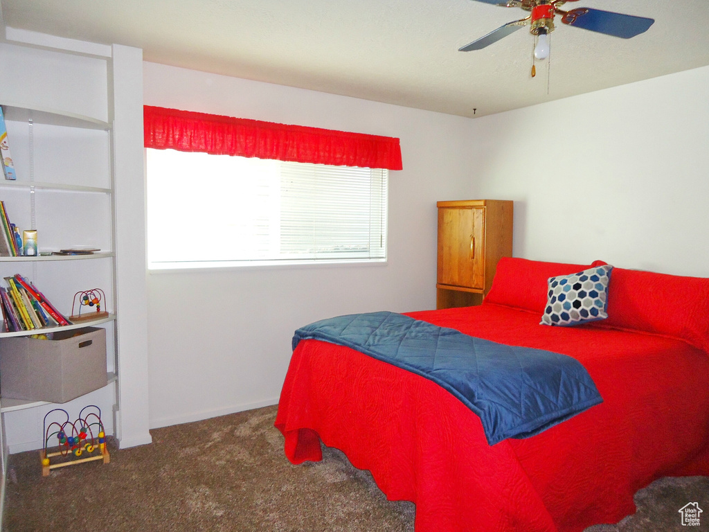 Bedroom with carpet and ceiling fan