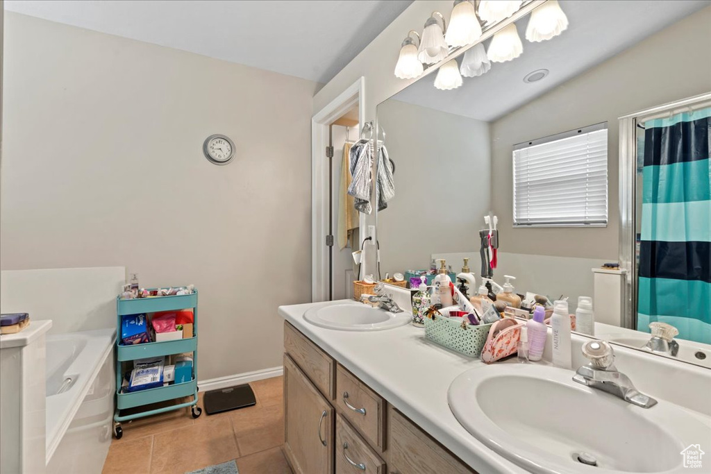Bathroom with a bath, tile patterned floors, double vanity, and a shower with shower curtain