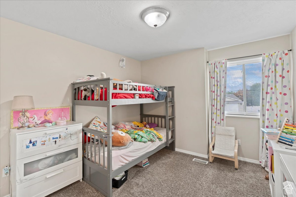 Bedroom with carpet and baseboards