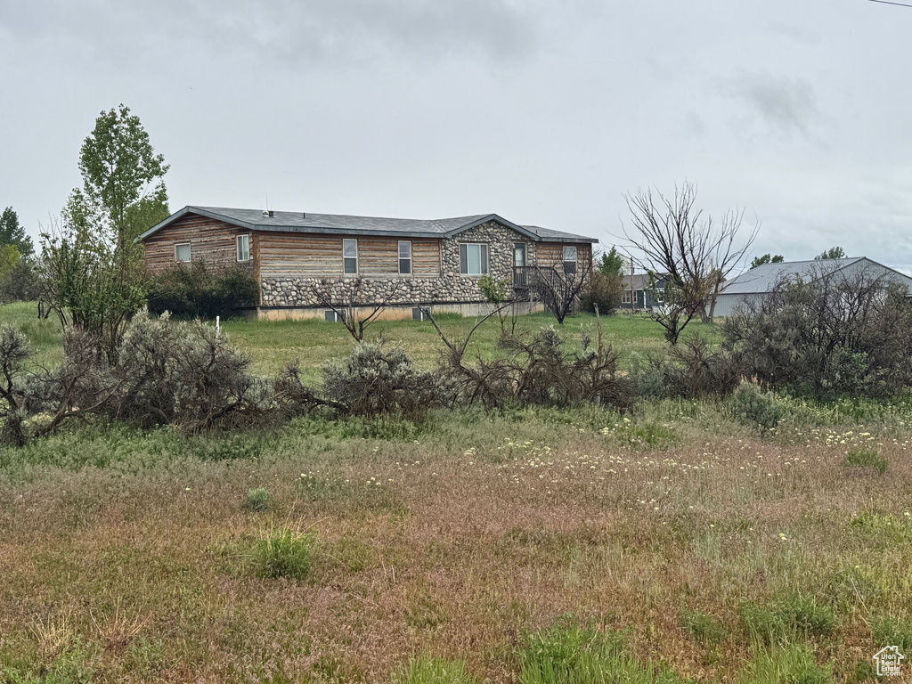 View of front of property featuring stone siding
