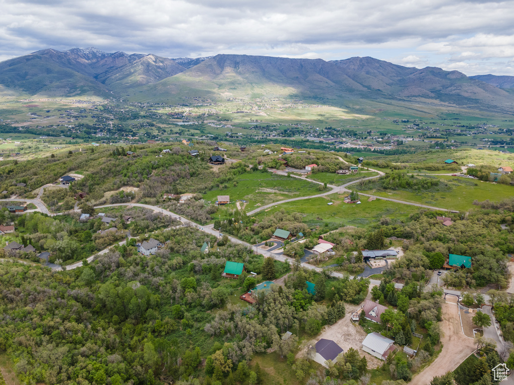Aerial overview of property\'s location with a mountainous background