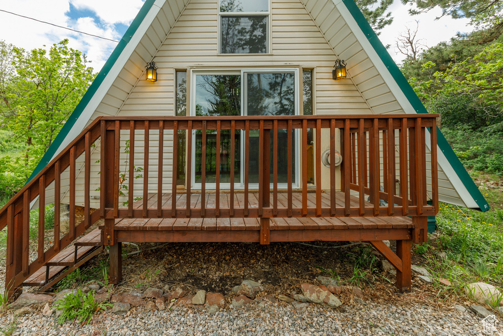 Back of property with a wooden deck