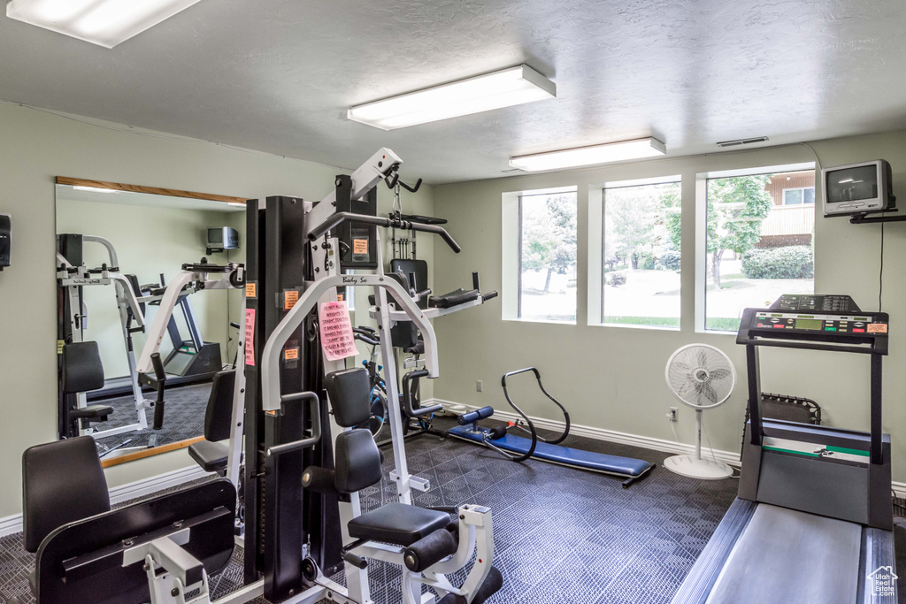 Workout area featuring baseboards
