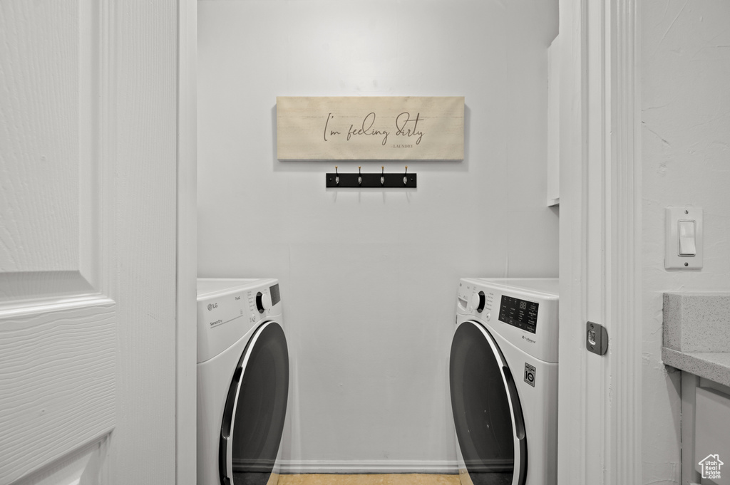 Laundry room featuring washing machine and dryer