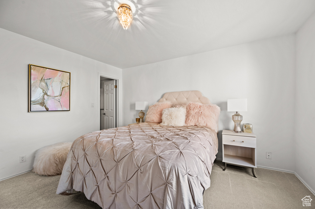 Bedroom with carpet and baseboards