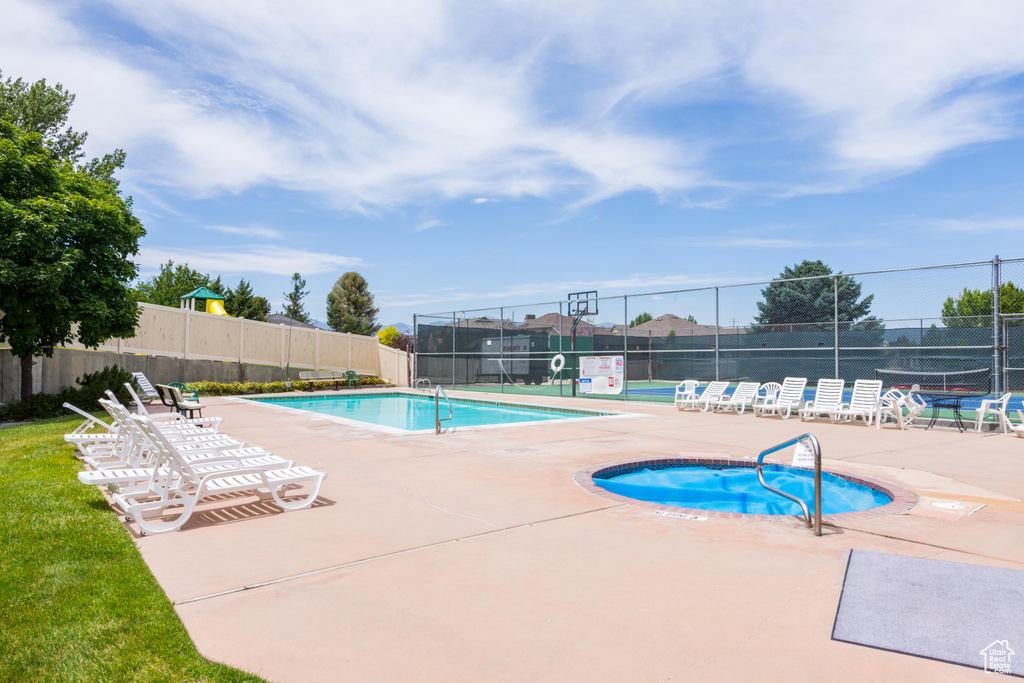 Community pool featuring fence