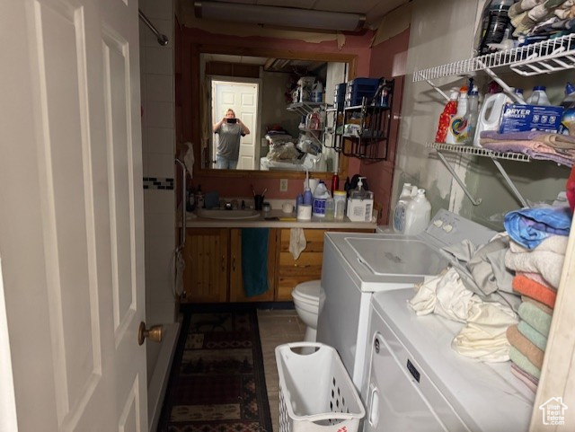 Laundry area with washer and clothes dryer
