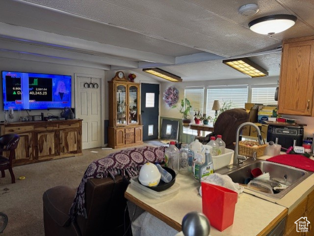 Dining space featuring carpet floors and beam ceiling