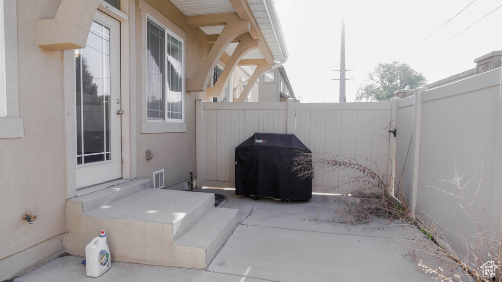 View of patio / terrace featuring area for grilling and a fenced backyard