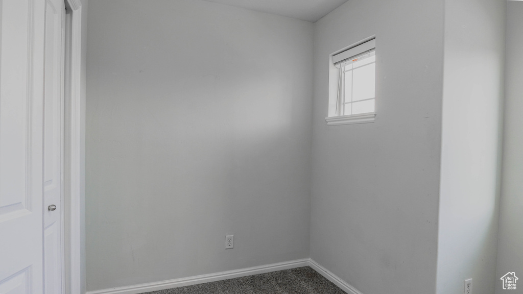 Unfurnished room with baseboards and carpet flooring