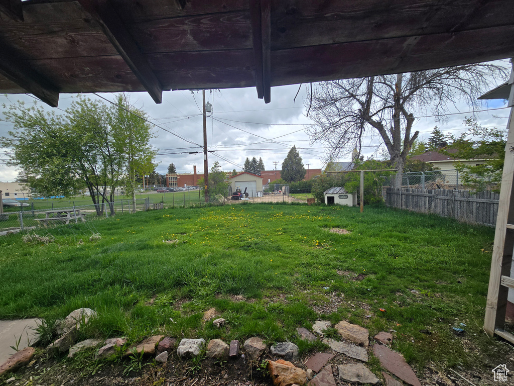 View of yard featuring fence