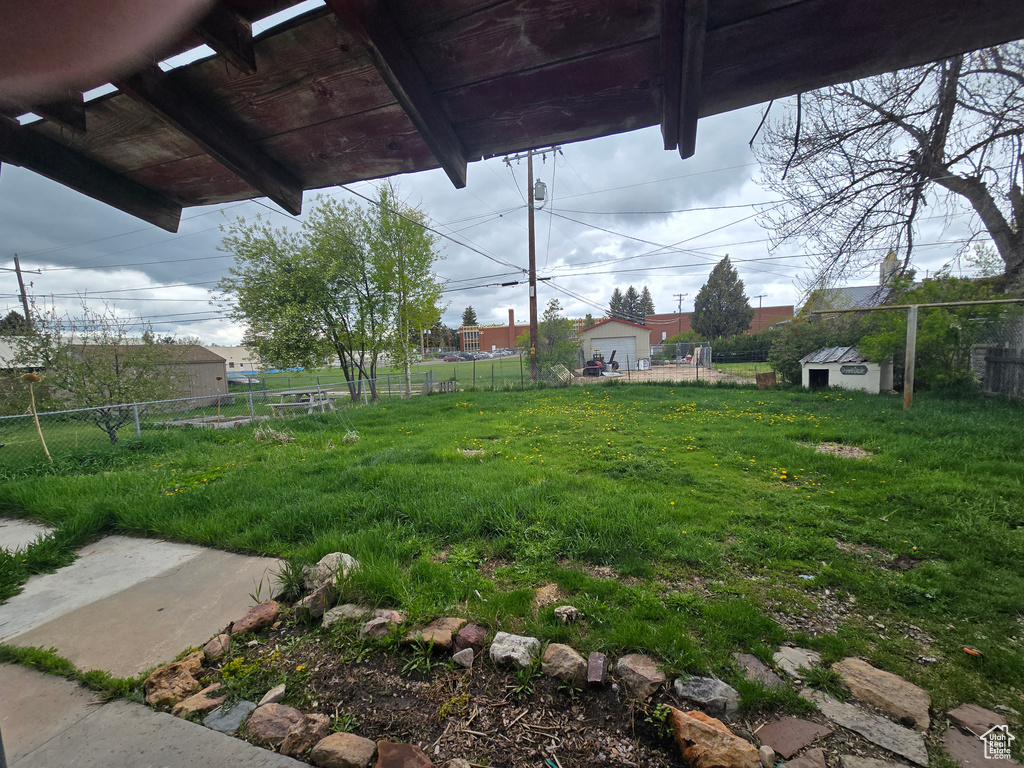 View of yard featuring fence