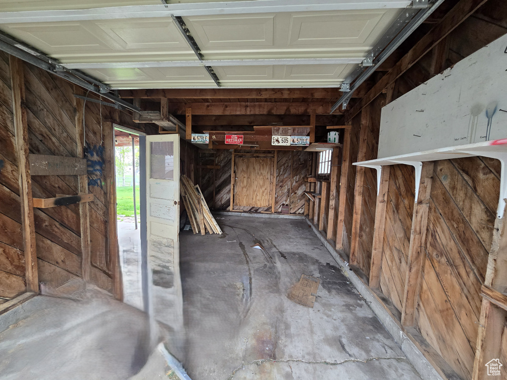 Garage featuring wooden walls