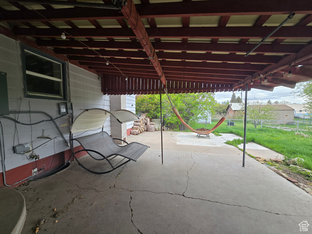 View of patio with fence