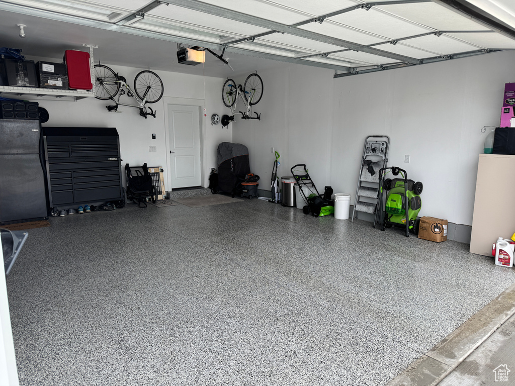 Garage featuring a garage door opener