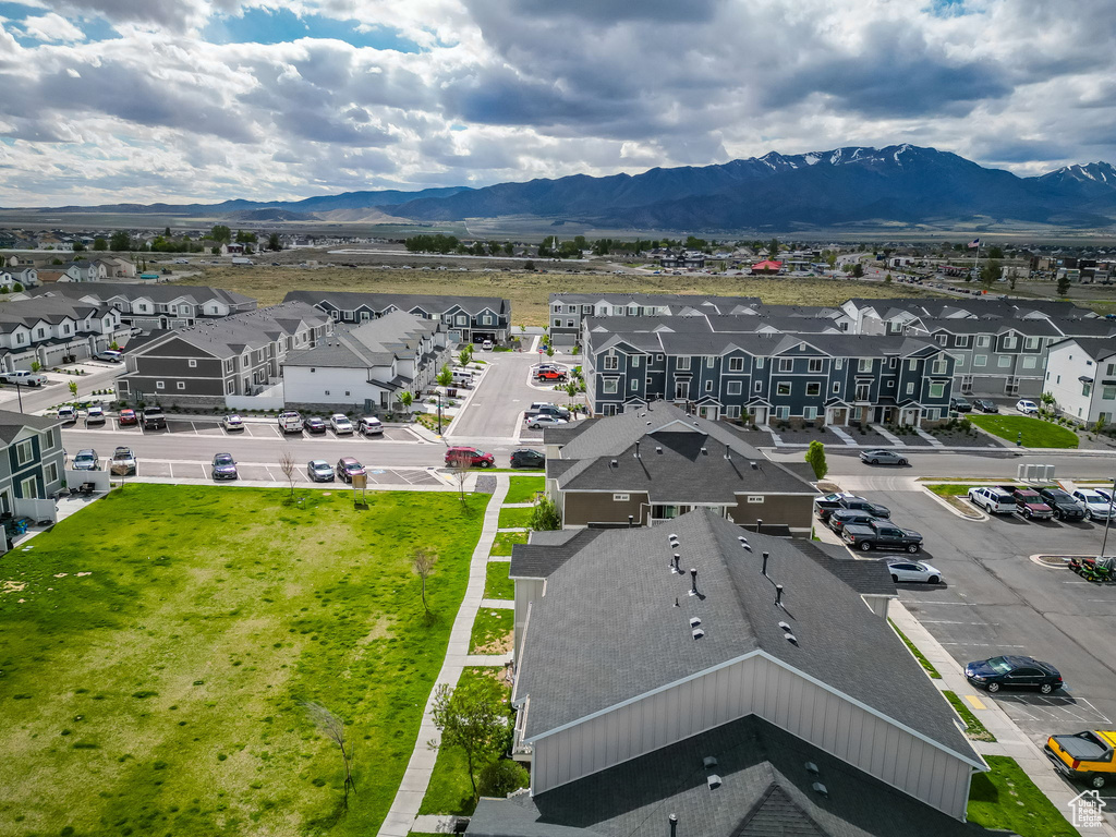 Aerial perspective of suburban area with a mountain backdrop
