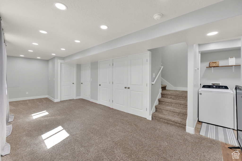 Finished basement featuring washer / clothes dryer, carpet floors, recessed lighting, baseboards, and stairs