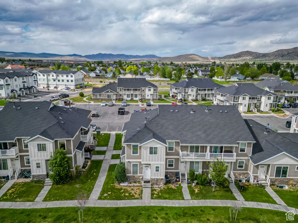Aerial perspective of suburban area with a mountainous background