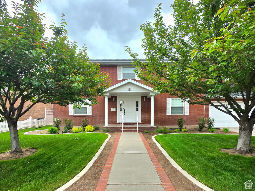 View of front of house with brick siding