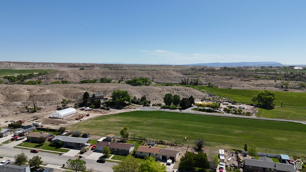 Aerial view of sparsely populated area featuring a mountain backdrop