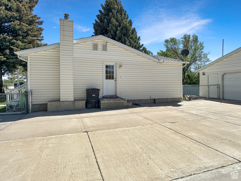 Back of property featuring a chimney