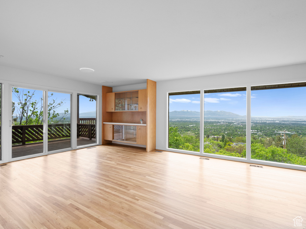 Unfurnished living room with light wood-style flooring