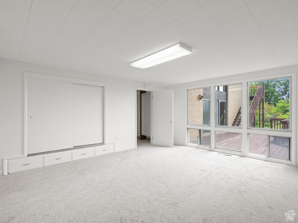 Spare room featuring carpet flooring