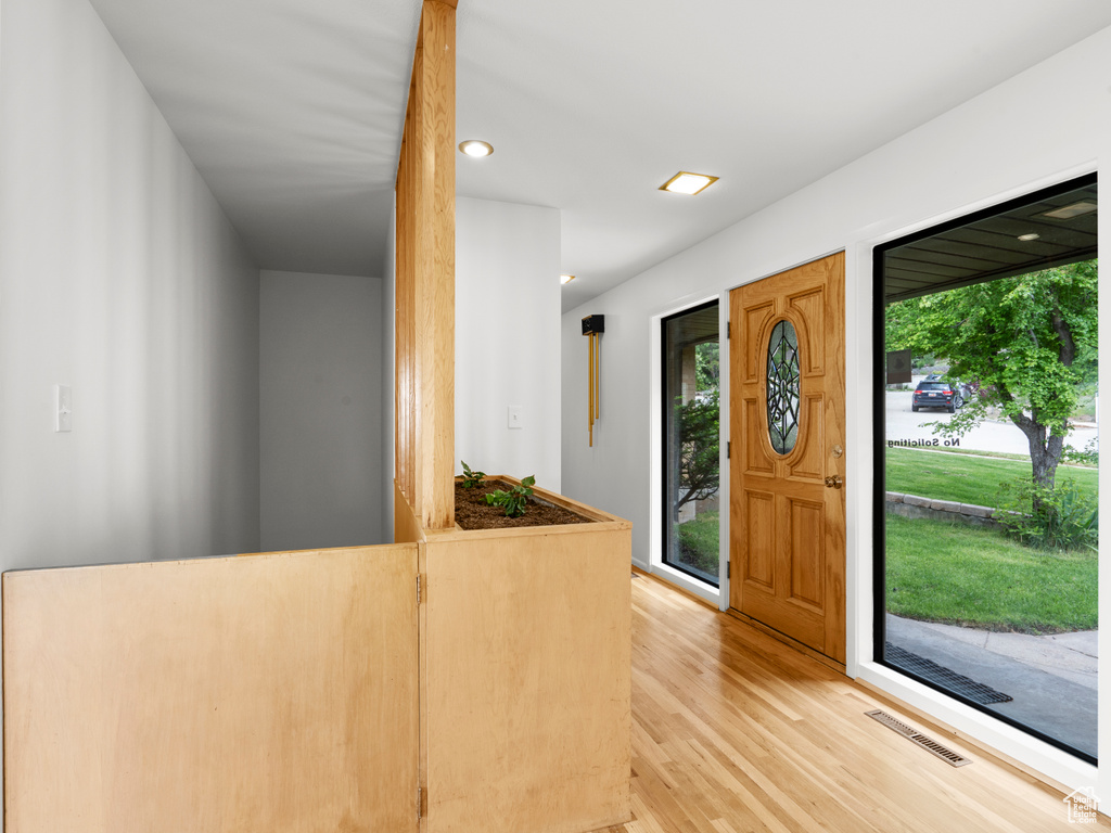 Entrance foyer featuring light wood finished floors and recessed lighting