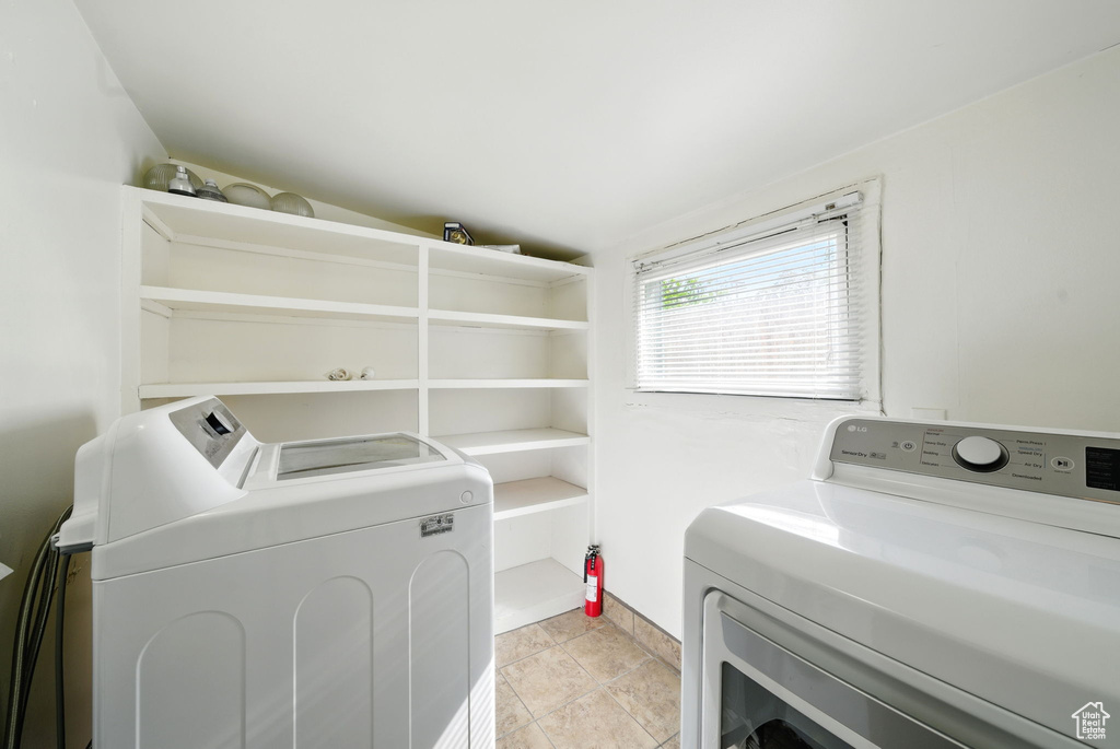 Washroom featuring washer and dryer