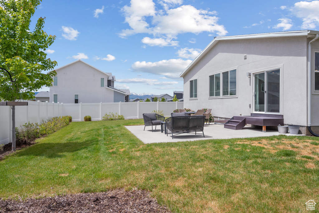 View of yard featuring a patio area and an outdoor hangout area