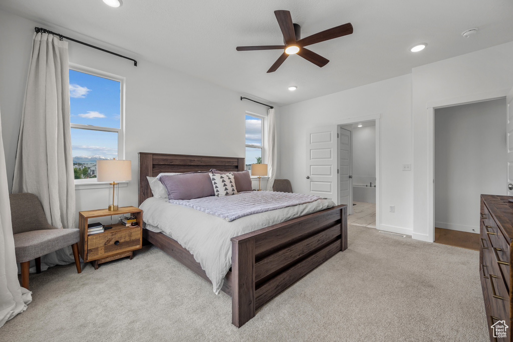 Bedroom featuring recessed lighting, light colored carpet, a ceiling fan, and baseboards
