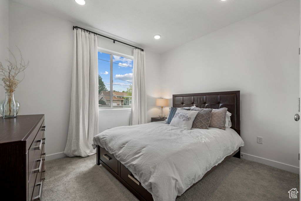 Bedroom featuring carpet flooring, baseboards, and recessed lighting