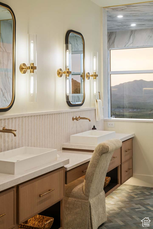 Bathroom with vanity and wainscoting