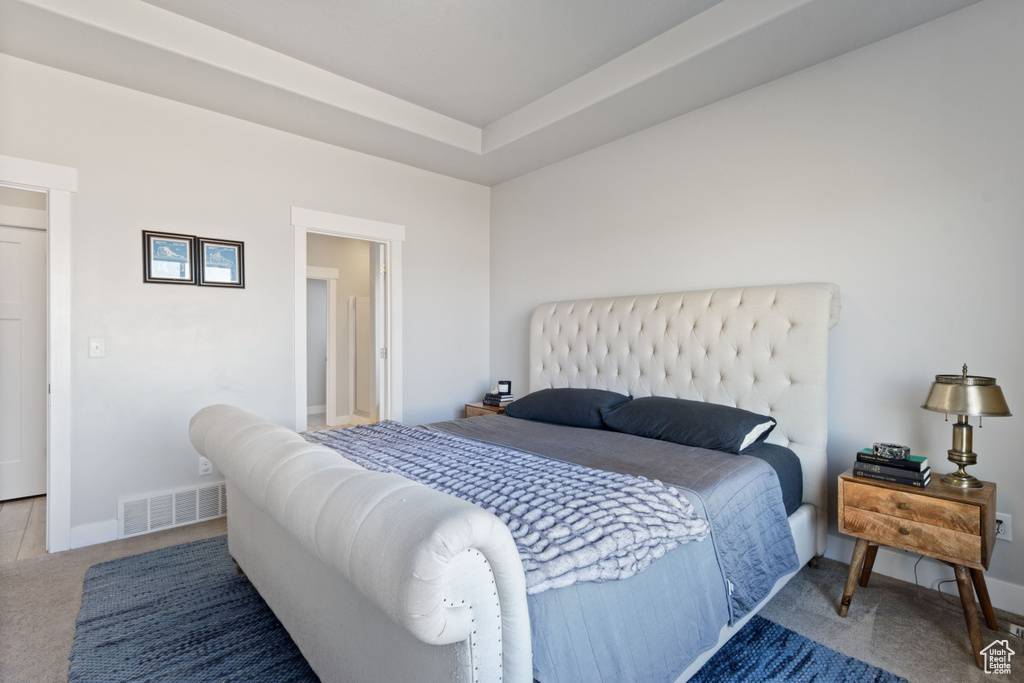Carpeted bedroom with baseboards