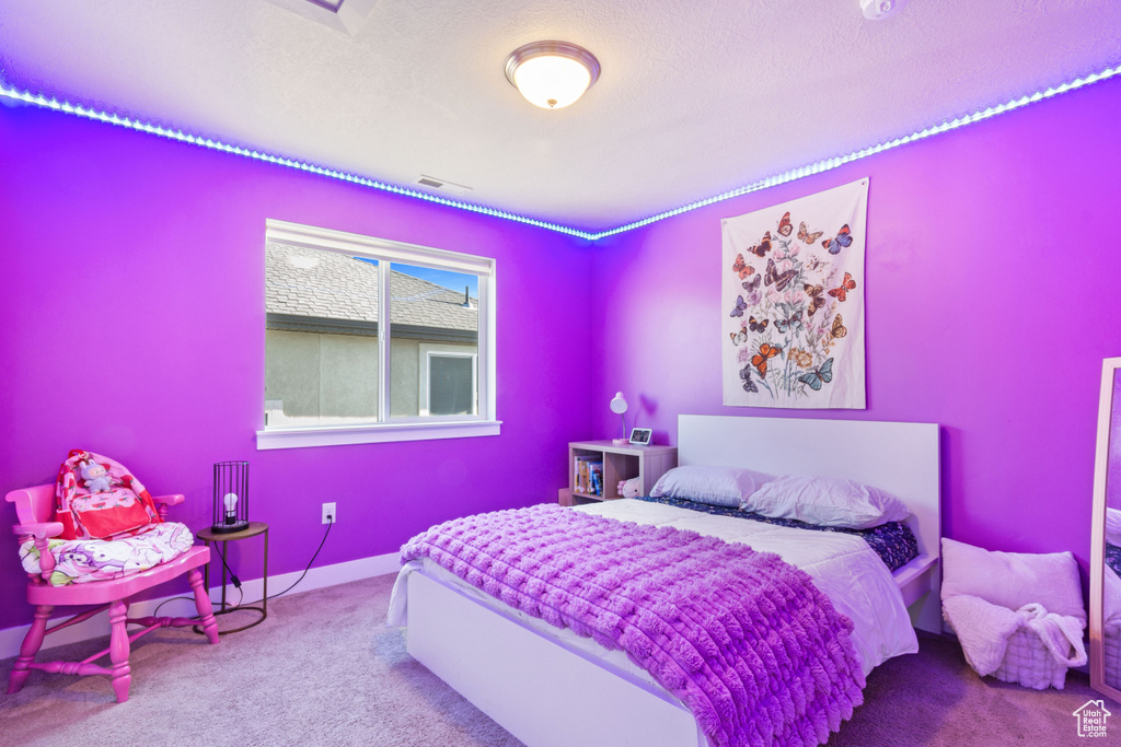 Bedroom with carpet flooring and baseboards