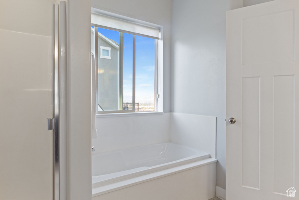 Full bath featuring a garden tub