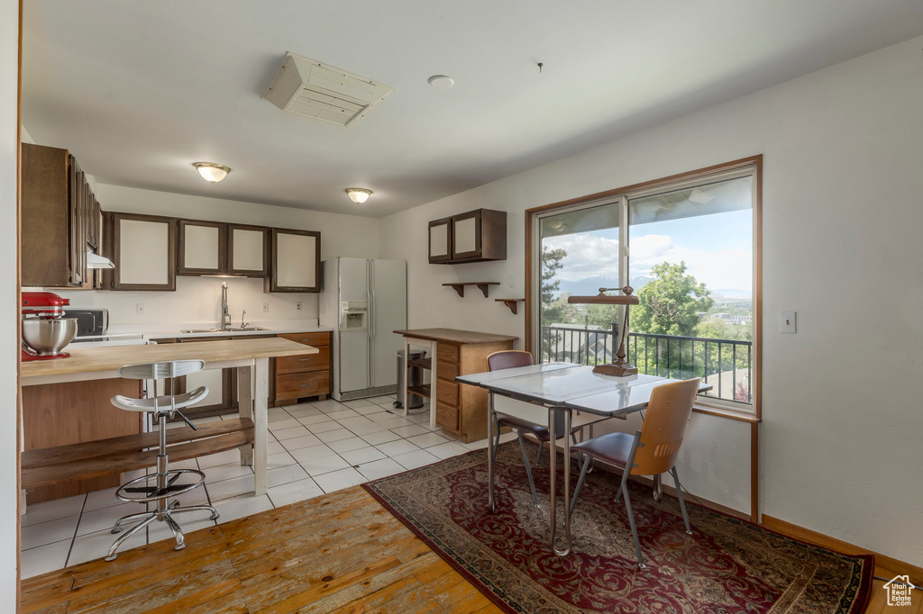 Dining room featuring light wood-style flooring and baseboards
