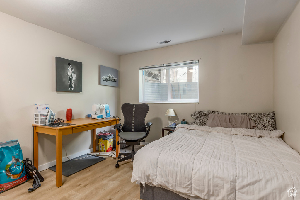 Bedroom with wood finished floors