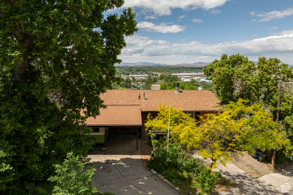 View from above of property with a mountain backdrop