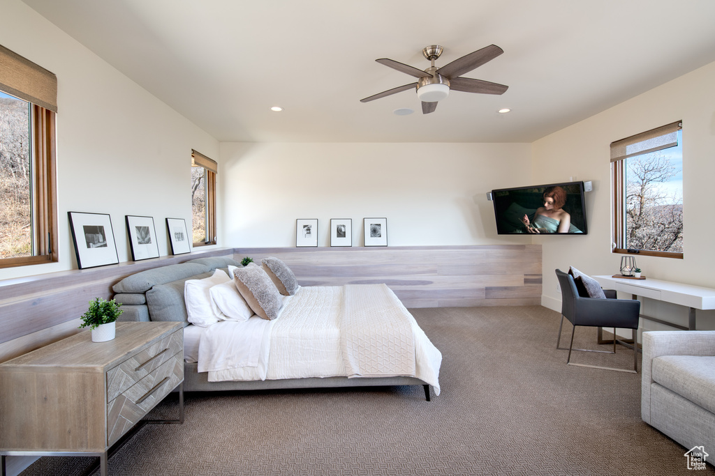 Carpeted bedroom featuring recessed lighting and a ceiling fan