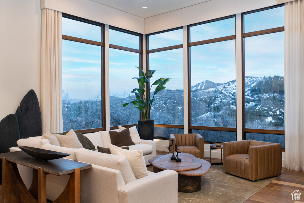 Living area featuring a mountain view, wood finished floors, and recessed lighting