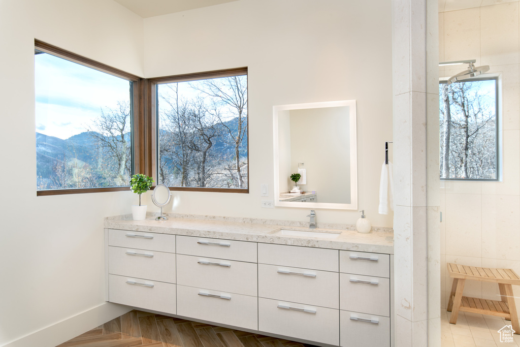 Bathroom with vanity and baseboards