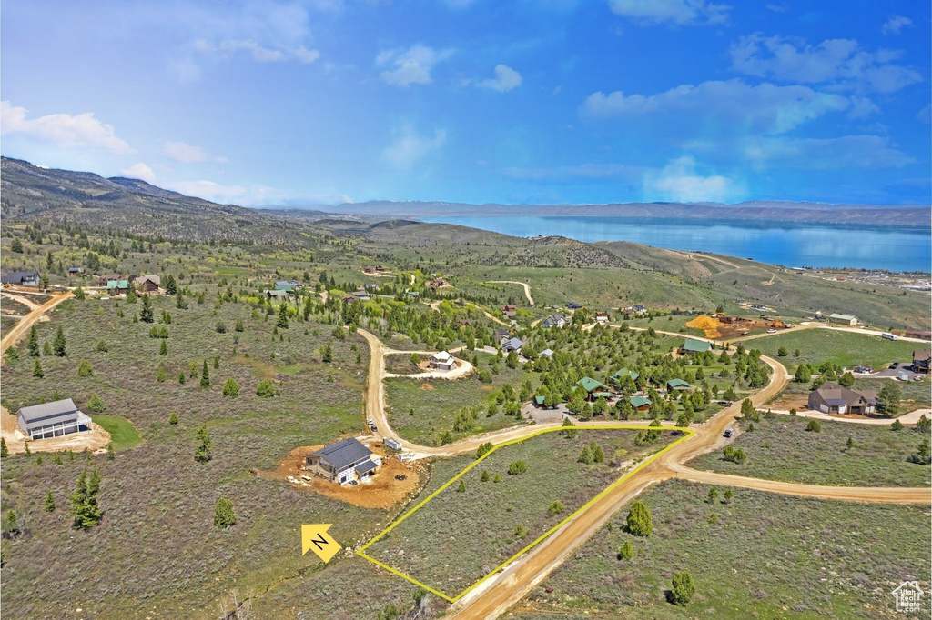 View of property location with a water and mountain view and property boundaries highlighted