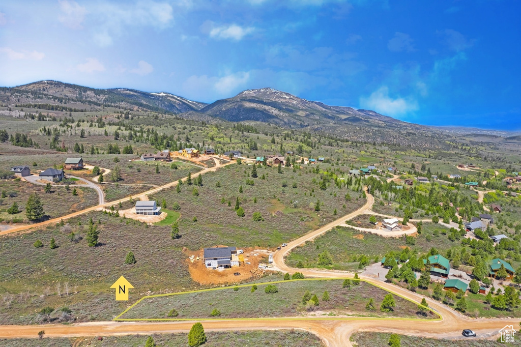 View of property location featuring a mountain backdrop and rural landscape