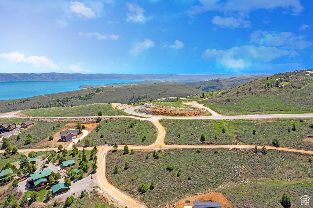 View of property location with a water and mountain view