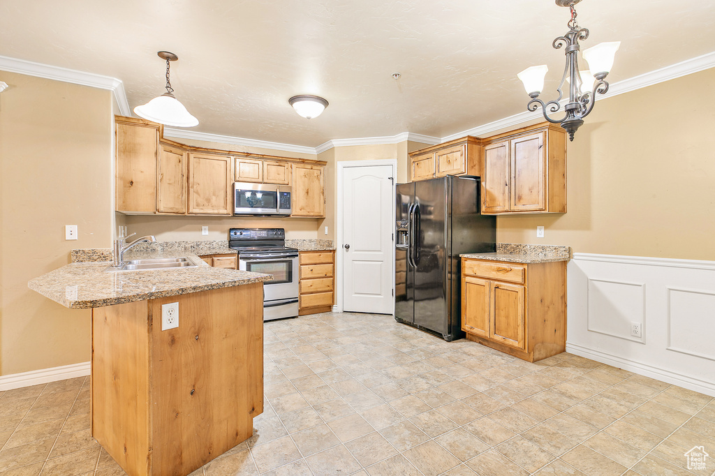 Kitchen featuring stainless steel appliances, a peninsula, crown molding, a sink, and light stone counters