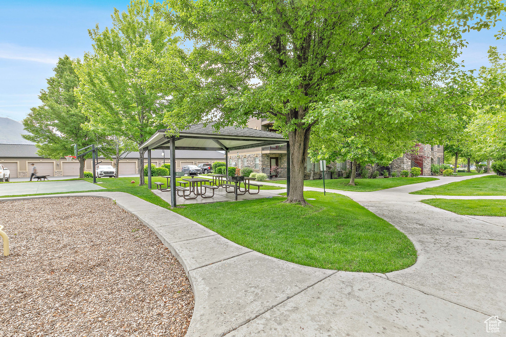 Surrounding community with a gazebo and a lawn