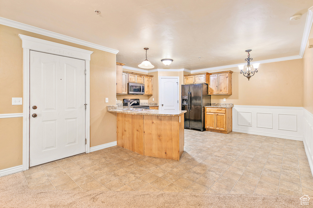 Kitchen featuring black fridge with ice dispenser, stainless steel microwave, a peninsula, range with electric stovetop, and crown molding