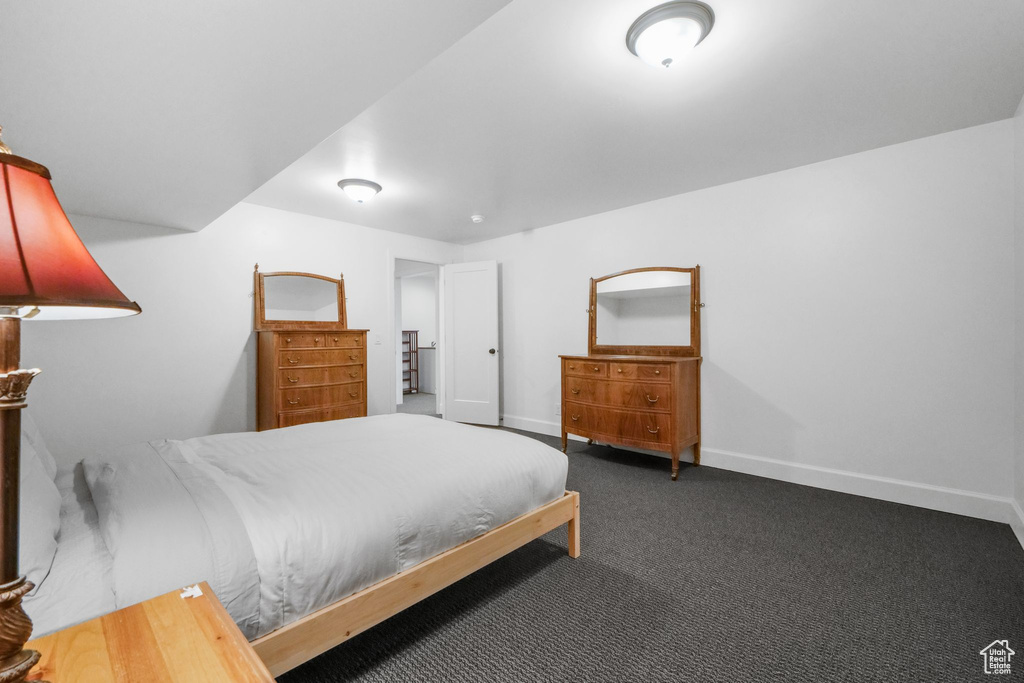 Carpeted bedroom with baseboards
